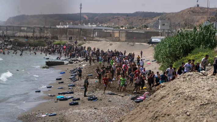 Border Breach Bedlam: Thousands Storm Spanish Enclave, Chaos Ensues!