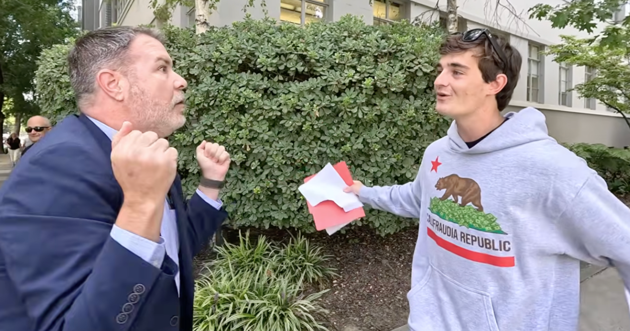 Politician's Aide Goes Full Middle School, Crashes Interview With Crude "Small Penis" Sign!