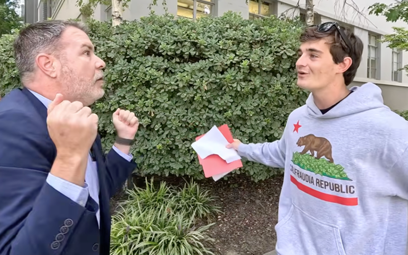Politician's Aide Goes Full Middle School, Crashes Interview With Crude "Small Penis" Sign!